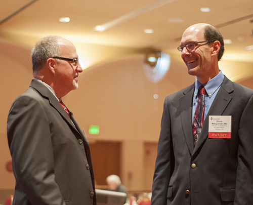 Marc Williams, MD, FAAP, FACMG, director of the Genomic Medicine Institute at Geisinger Health System, talks with David Wargowski, MD, at Seminars in Pediatrics.