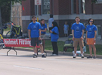 The volunteer team waits at one of the helmet fit stations.
